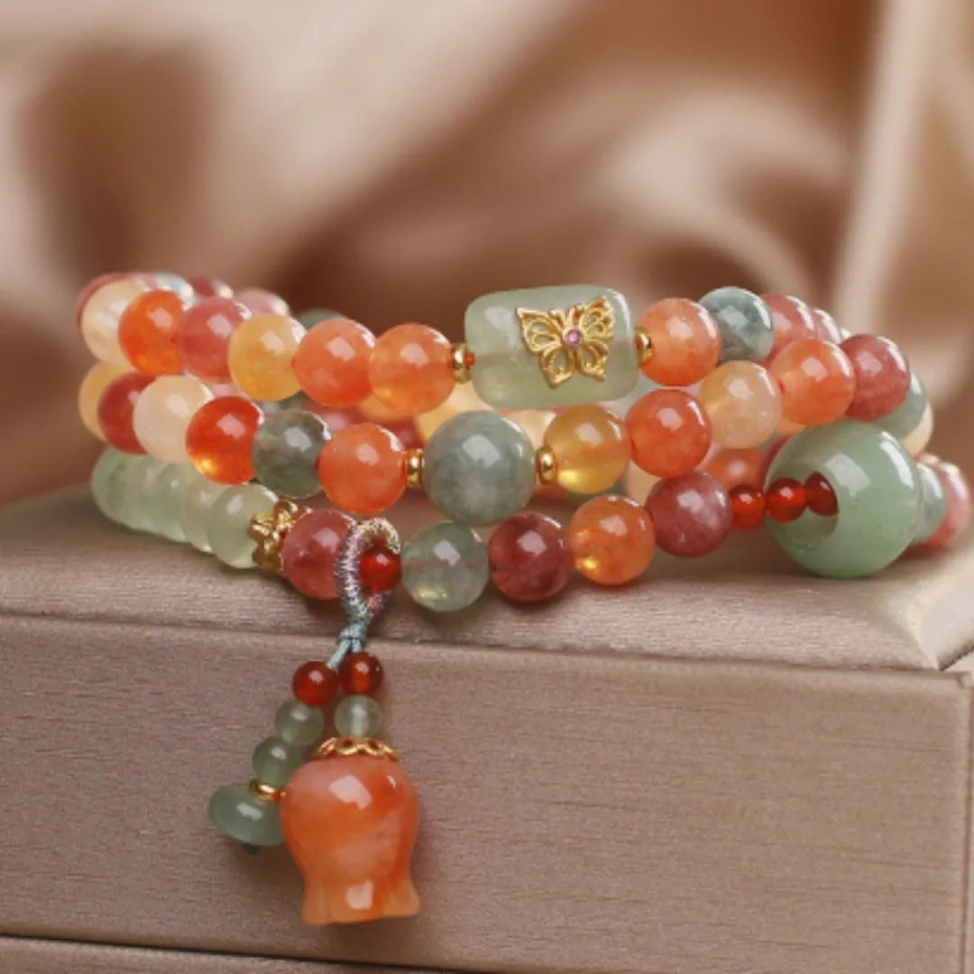 Natural Jinsi Jade multi-circle bracelet with round beads and lily pendant on display