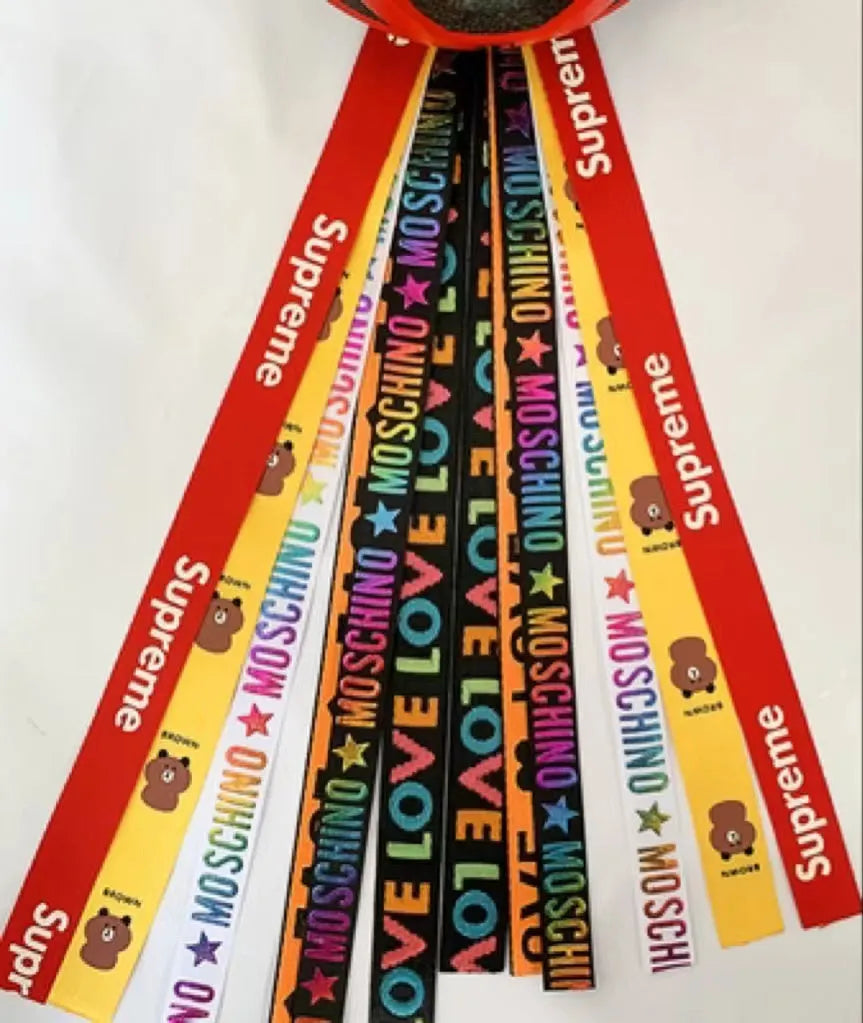 Colourful decorative ribbon streamers attached to a children safety helmet for skating or skiing