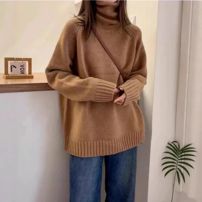 Women's loose thick turtleneck sweater with a textured 3D curling collar in a red solid colour.