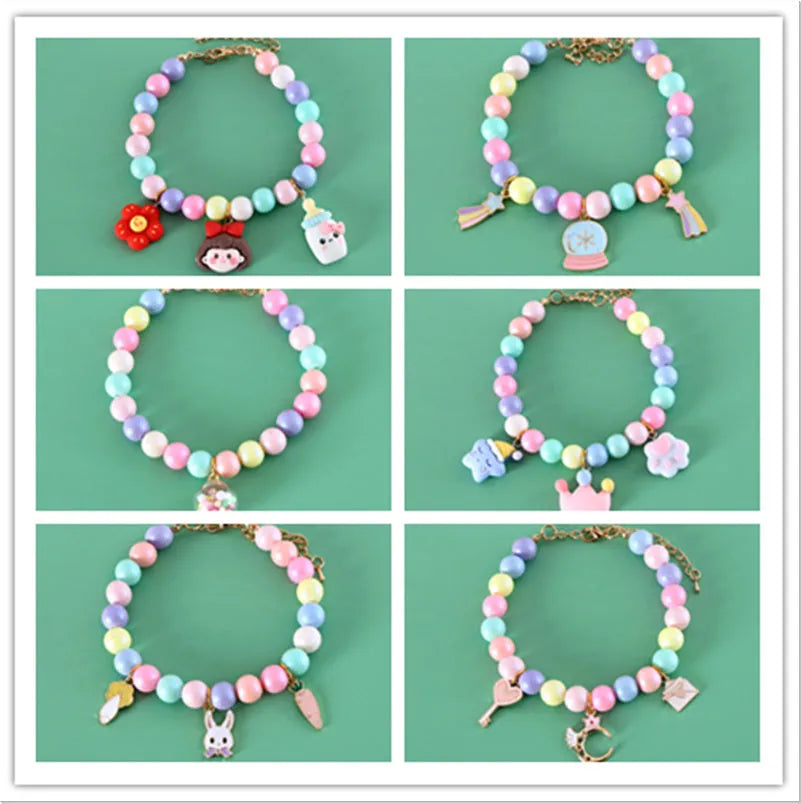 Colourful macaron charm pet collar and matching bracelet set in resin on a white background.
