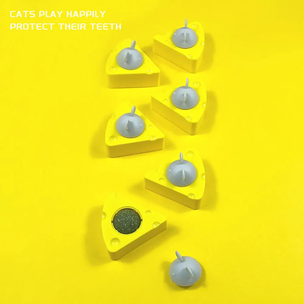 Yellow catnip and silvervine chew toy balls for cats with wall-mounting feature