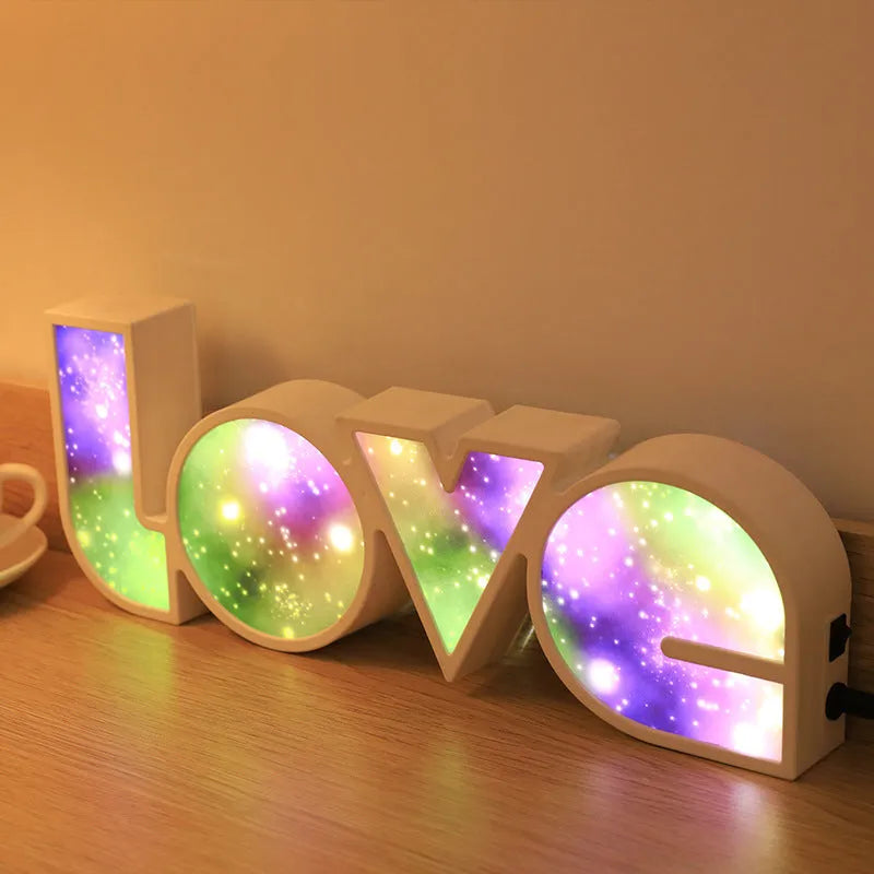 Colourful LED love light decorative lamp with plastic shell on a table