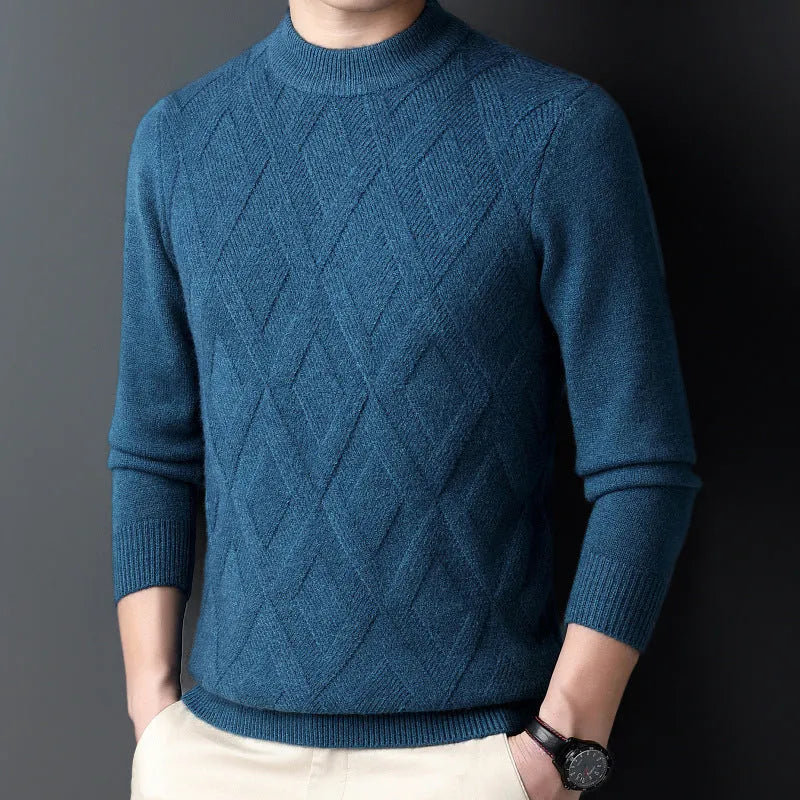 Man wearing a thick grey diamond jacquard knit pullover sweater.
