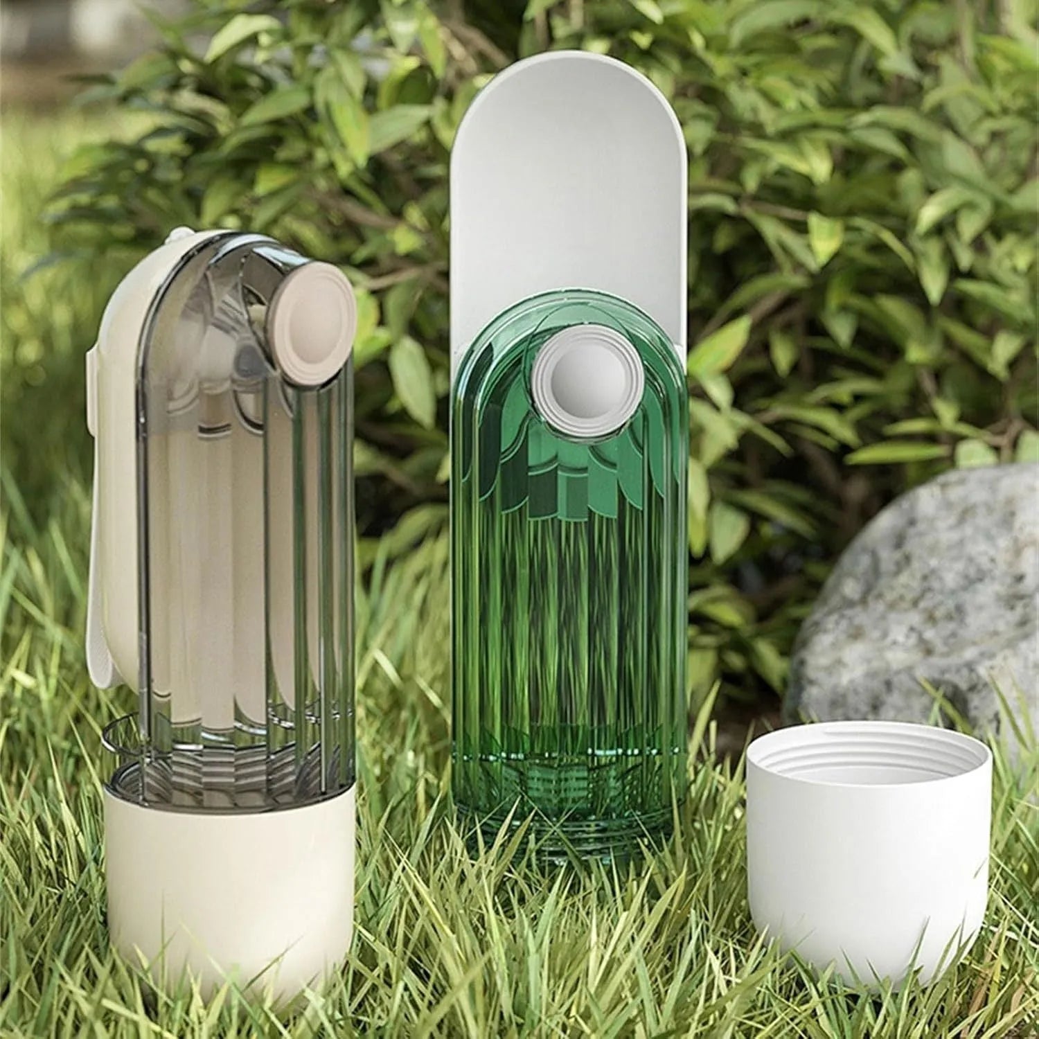 Foldable dog water bottle with food container in beige or green colour, showing drinking tray and dispenser mechanism