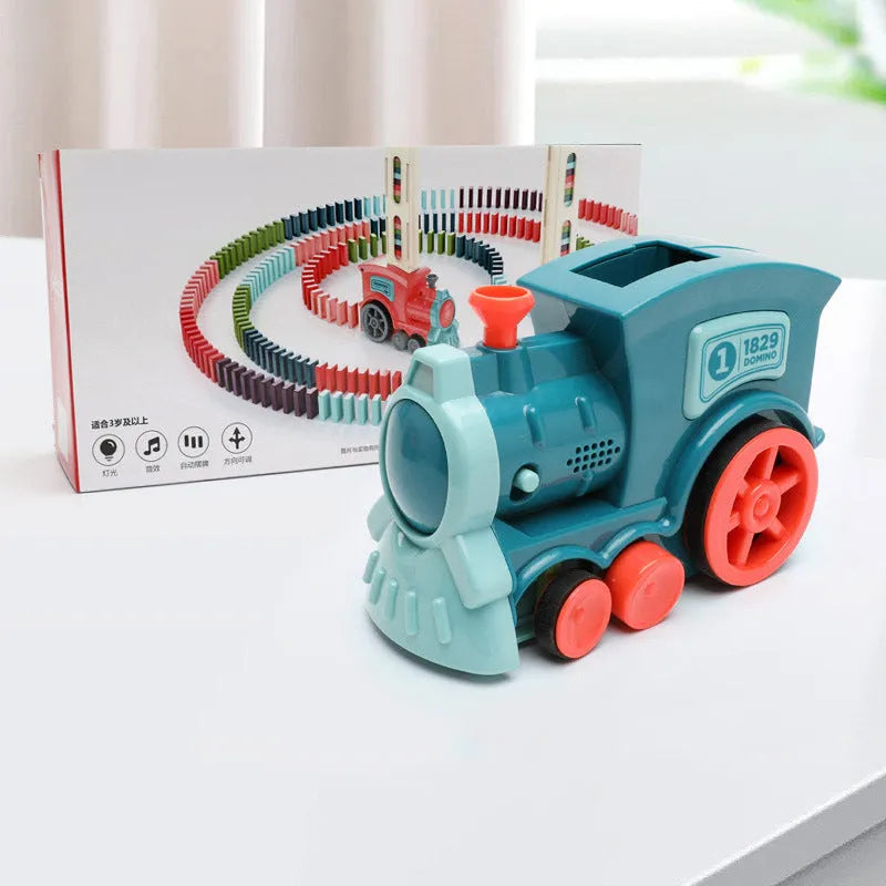 Domino train toy with 100 plastic dominoes in random colours, including toy train and card storage box