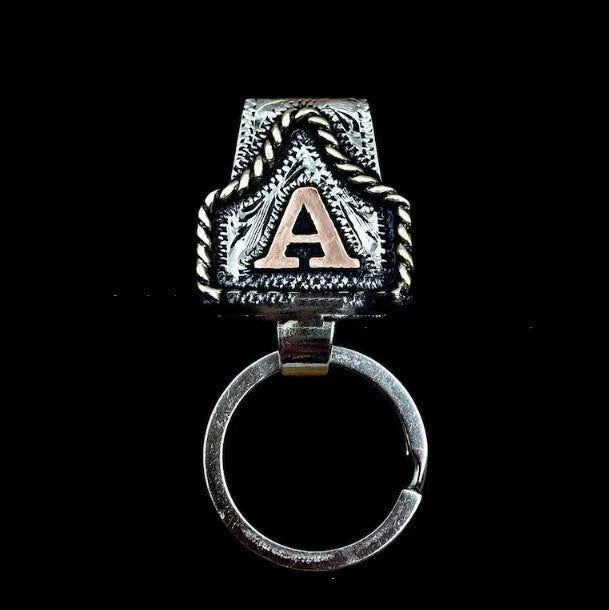 Handmade stainless steel cow tag belt key holder with engraved number plate on a split ring.
