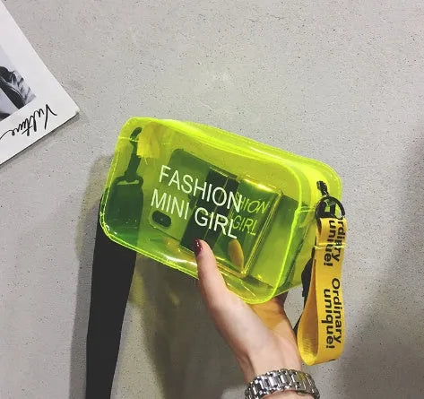 Transparent square women's shoulder bag in jelly material with a diagonal cross strap, showing internal mobile phone pocket.