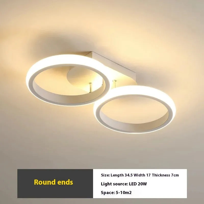 Modern simplicity hallway LED ceiling light in black with three round shapes over a corridor