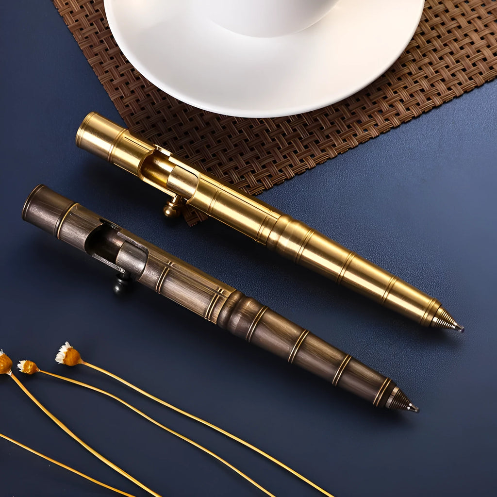 Retro brass tactical pen with cylindrical barrel and six-ring grip, shown with press mechanism extended