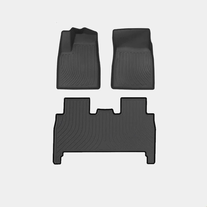 Rubber floor mat set for Tesla Model X showing foot pads and tailbox cushion for interior protection