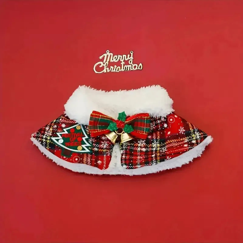 Pet wearing red Christmas cloak with bell design, draped over back with festive snowflake pattern