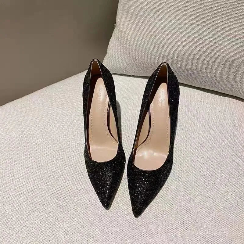 Women's silver and black wedding shoes with crystal detail and multiple heel height options
