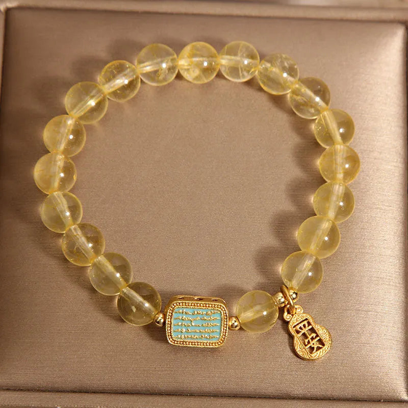 Women's natural citrine crystal bracelet with yellow colour and rhinestone detailing