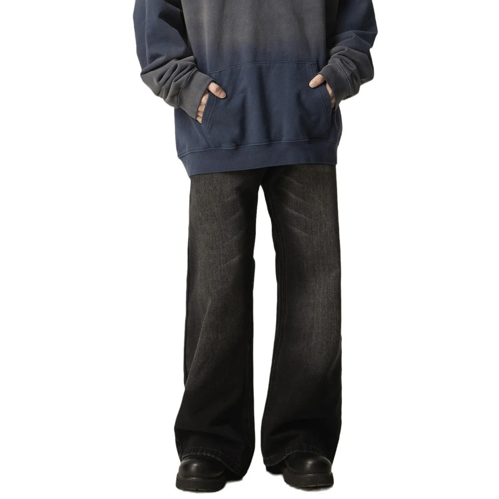 Black straight leg jeans with loose retro styling and basic zip fly design