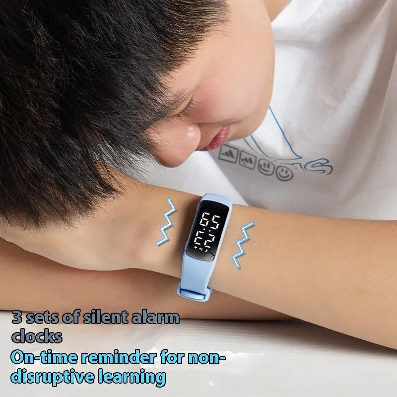 Electronic vibration alarm watch with LED display and silicone strap showing waterproof rating of 50 metres