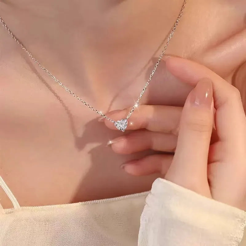 Silver-coloured copper love heart pendant necklace for women on a 16-inch chain.