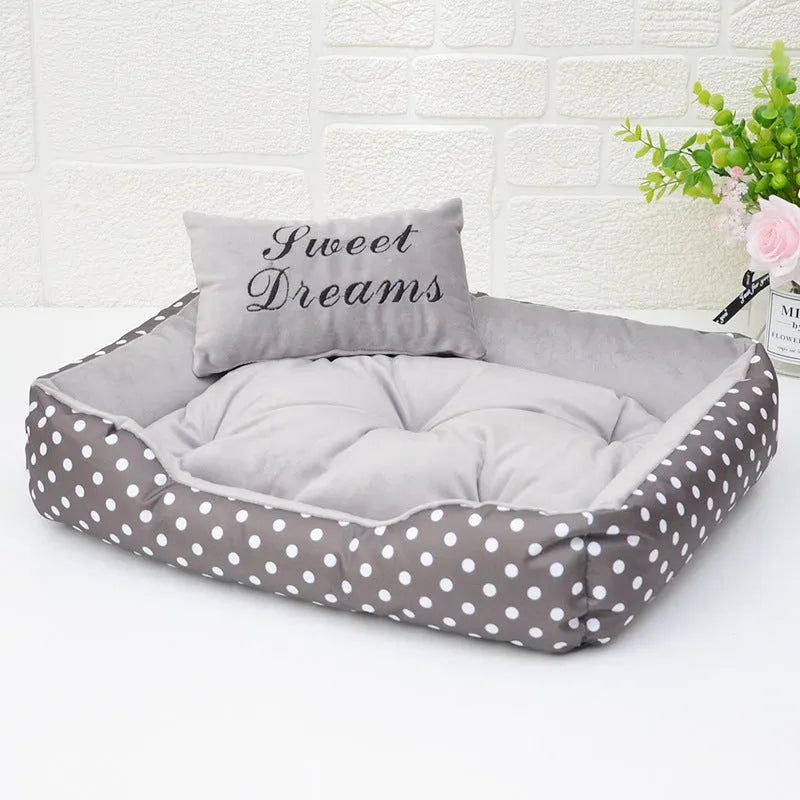 Small polka dot print dog bed with a square cushion, shown in grey colour.