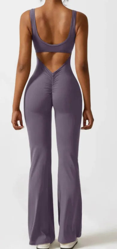 Women's black milk silk yoga bodysuit with hollow back and seamless construction on a mannequin.