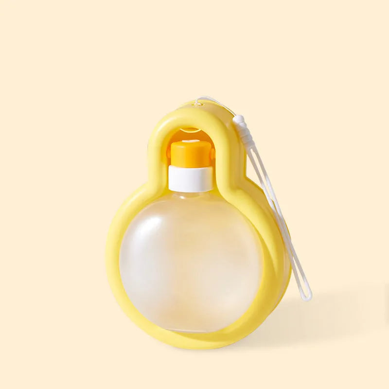 Green portable dog travel water bottle with integrated drinking bowl dispenser.
