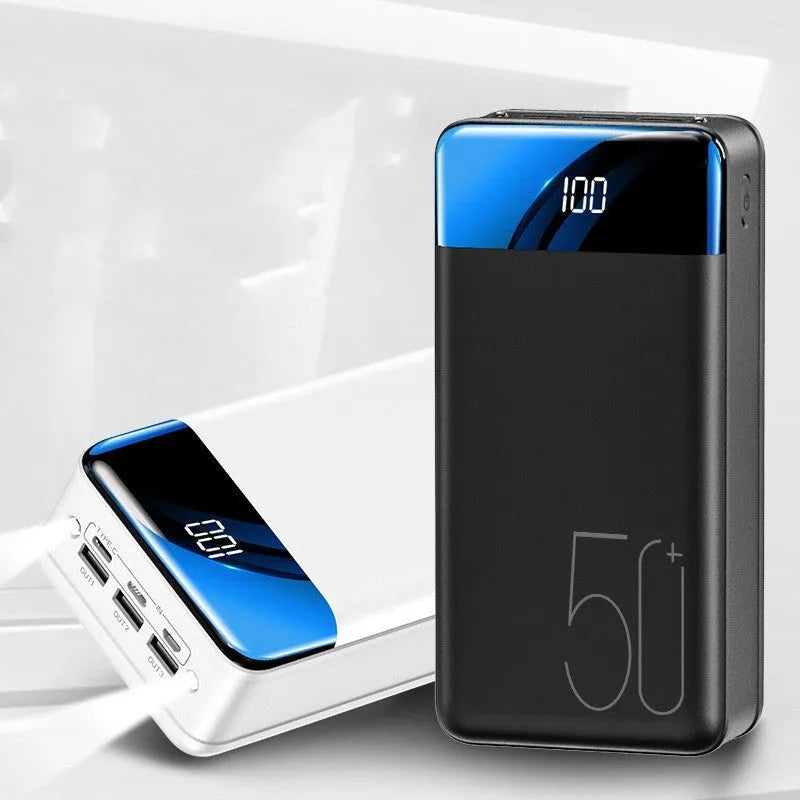 Large 50000mAh capacity power bank with three output ports in black or white plastic casing