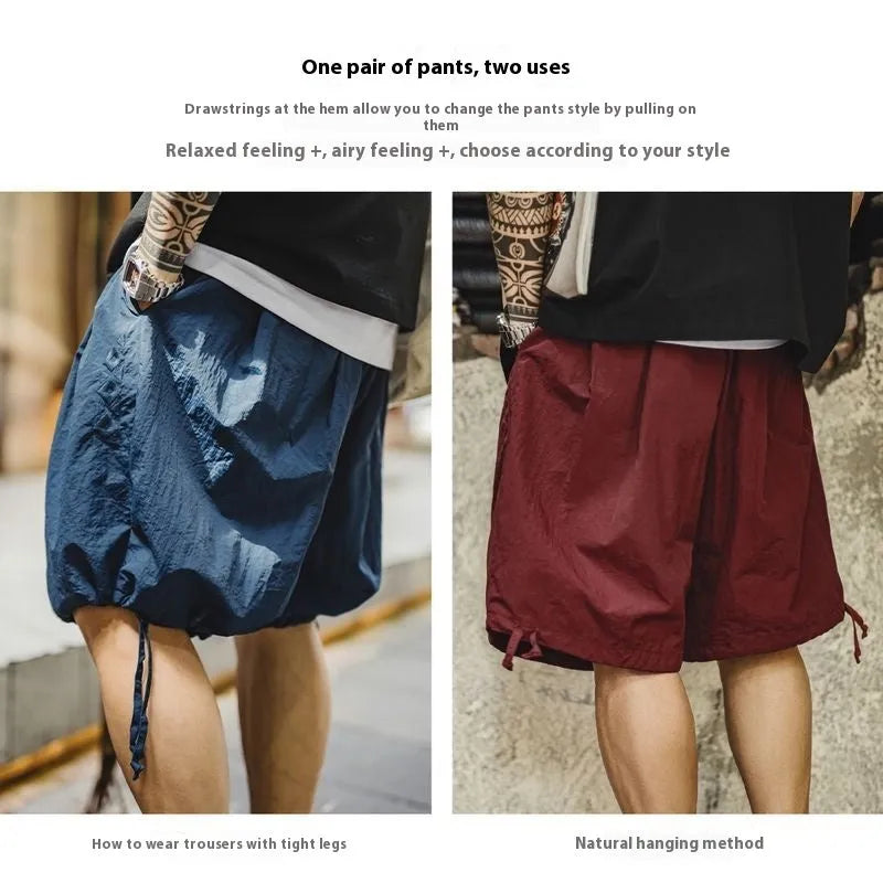 Prussian blue men's loose fit beach shorts with embroidery on lightweight nylon fabric.