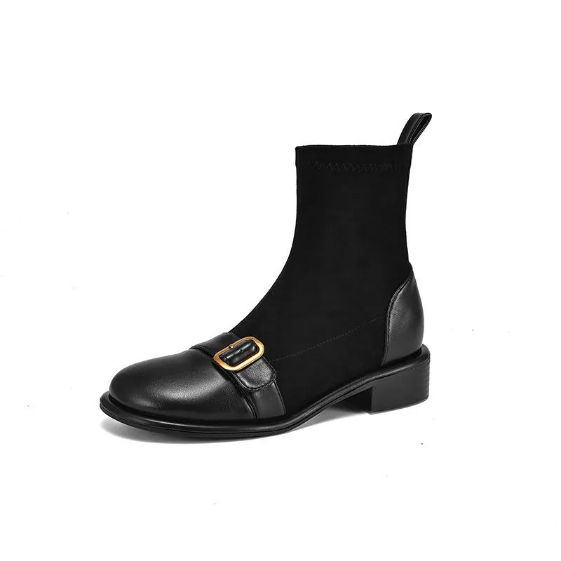 Black women's low heel martin boot with lace-up front and belt buckle stitching detail.