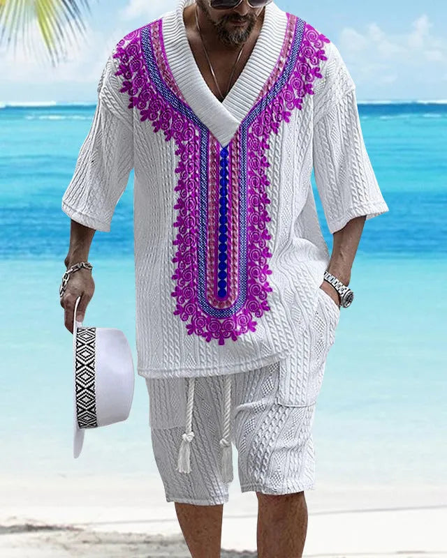 Men's grey printed knitted short-sleeved top and matching shorts on a hanger.