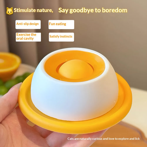 Yellow anti-spill slow feeder cat toy treat dispenser for cats on floor