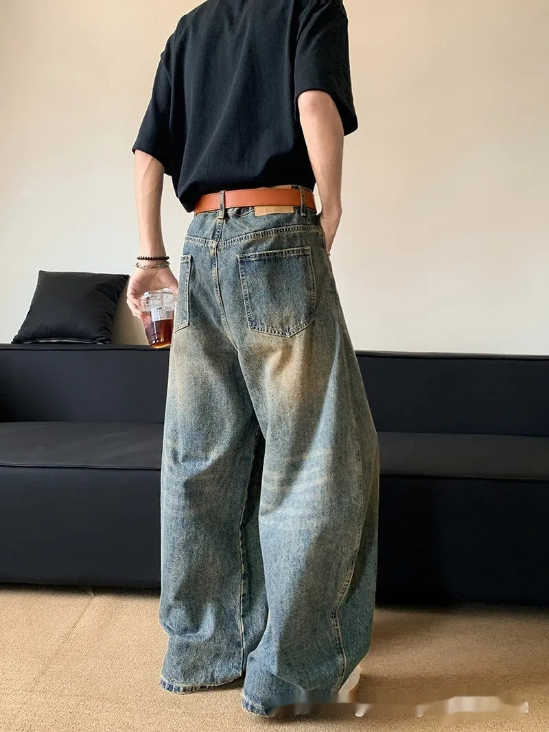 Men's retro blue distressed denim jeans with wide-leg silhouette and micro elasticity fabric