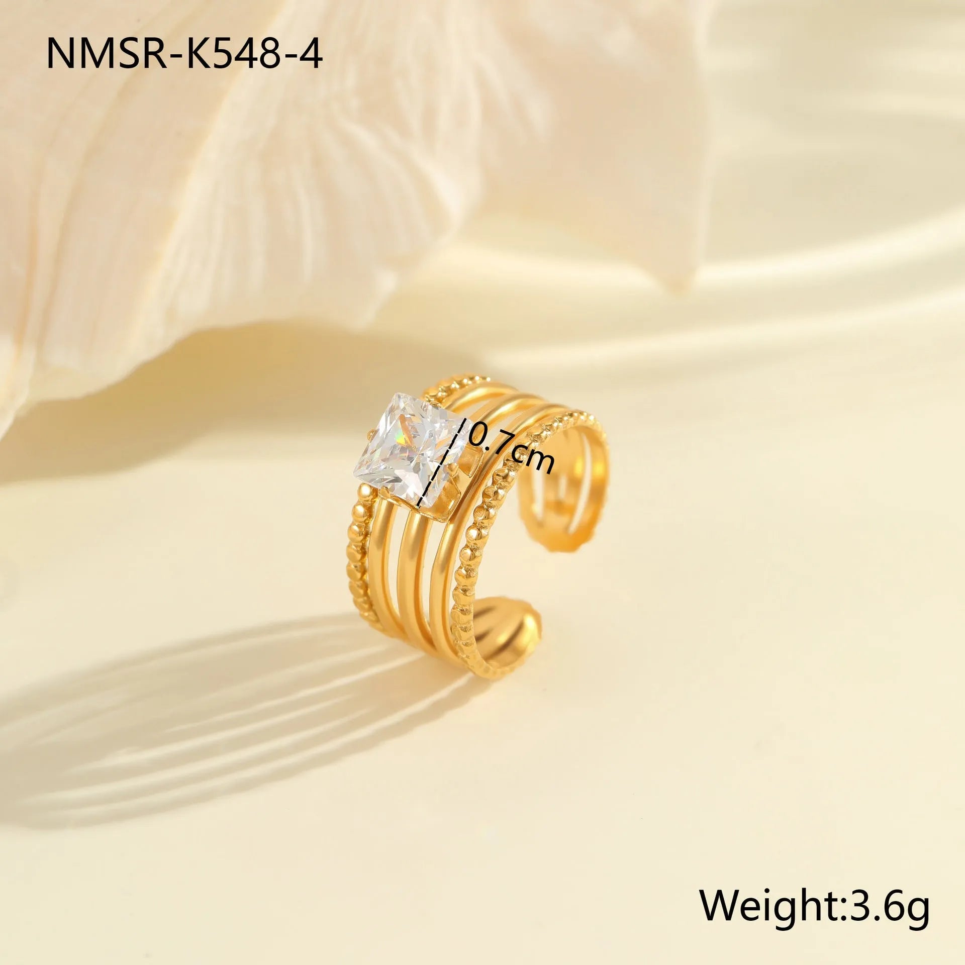 Stainless steel women's ring with gold electroplating and zircon details in geometry design