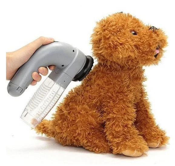 Grey cordless handheld pet hair vacuum grooming brush with soft rubber head