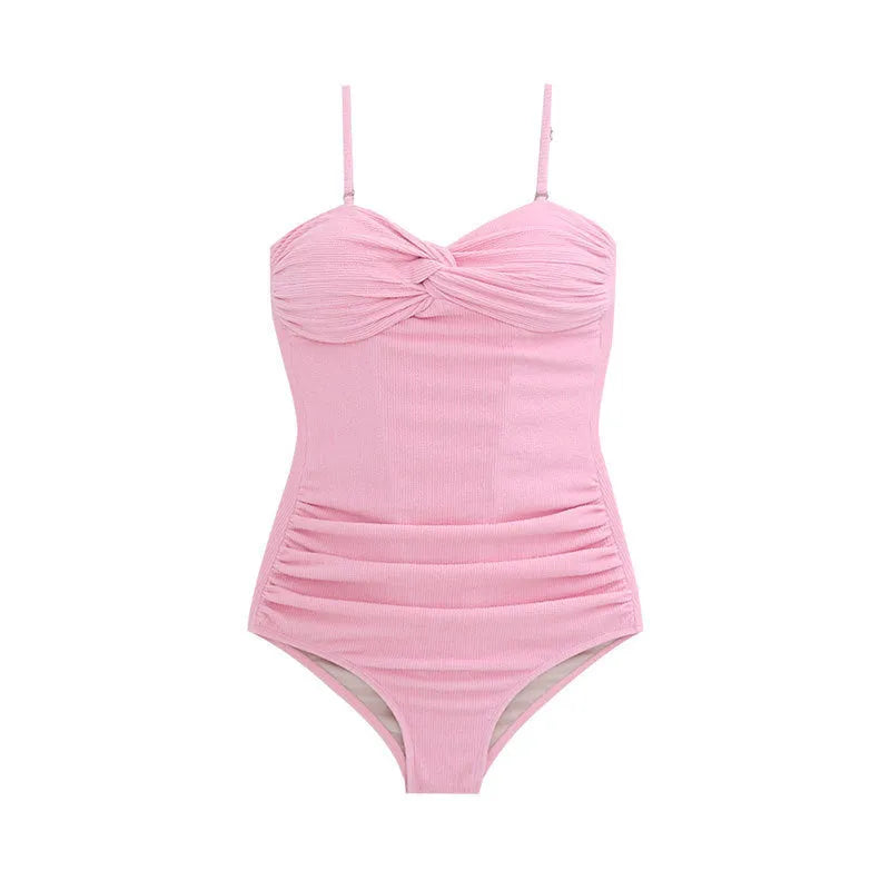 Women's black suspender-style one-piece swimsuit with high-waist design on a mannequin