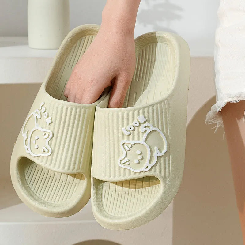 Women's green cat slippers with thick EVA platform sole, shown from above.