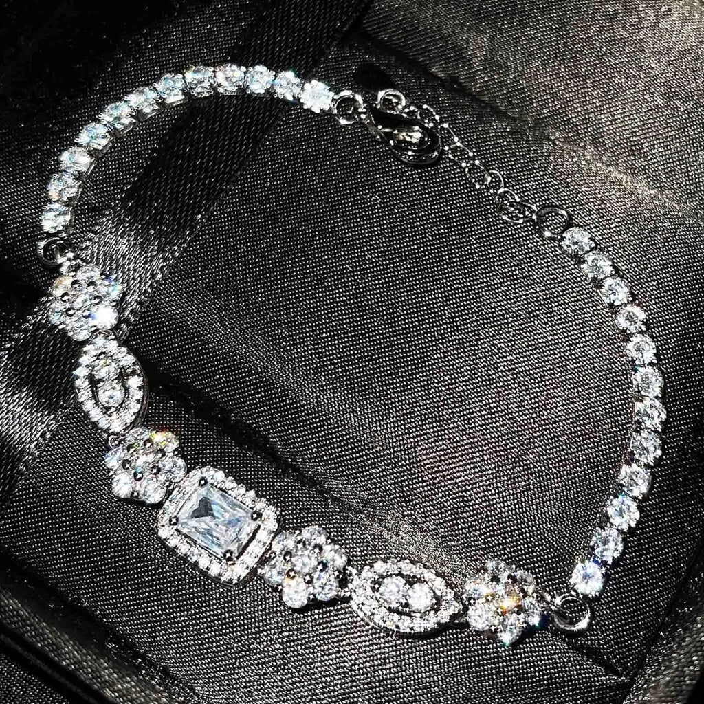 Women's sterling silver plated bracelet with zircon inlaid stones in geometric luxury style