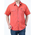 Men's cotton short sleeve loose fit cardigan shirt in dark blue on a model, summer workwear style