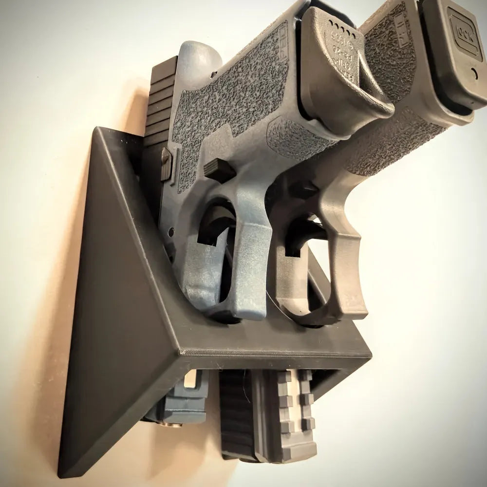 Black punk-style plastic pistol stand for firearm display