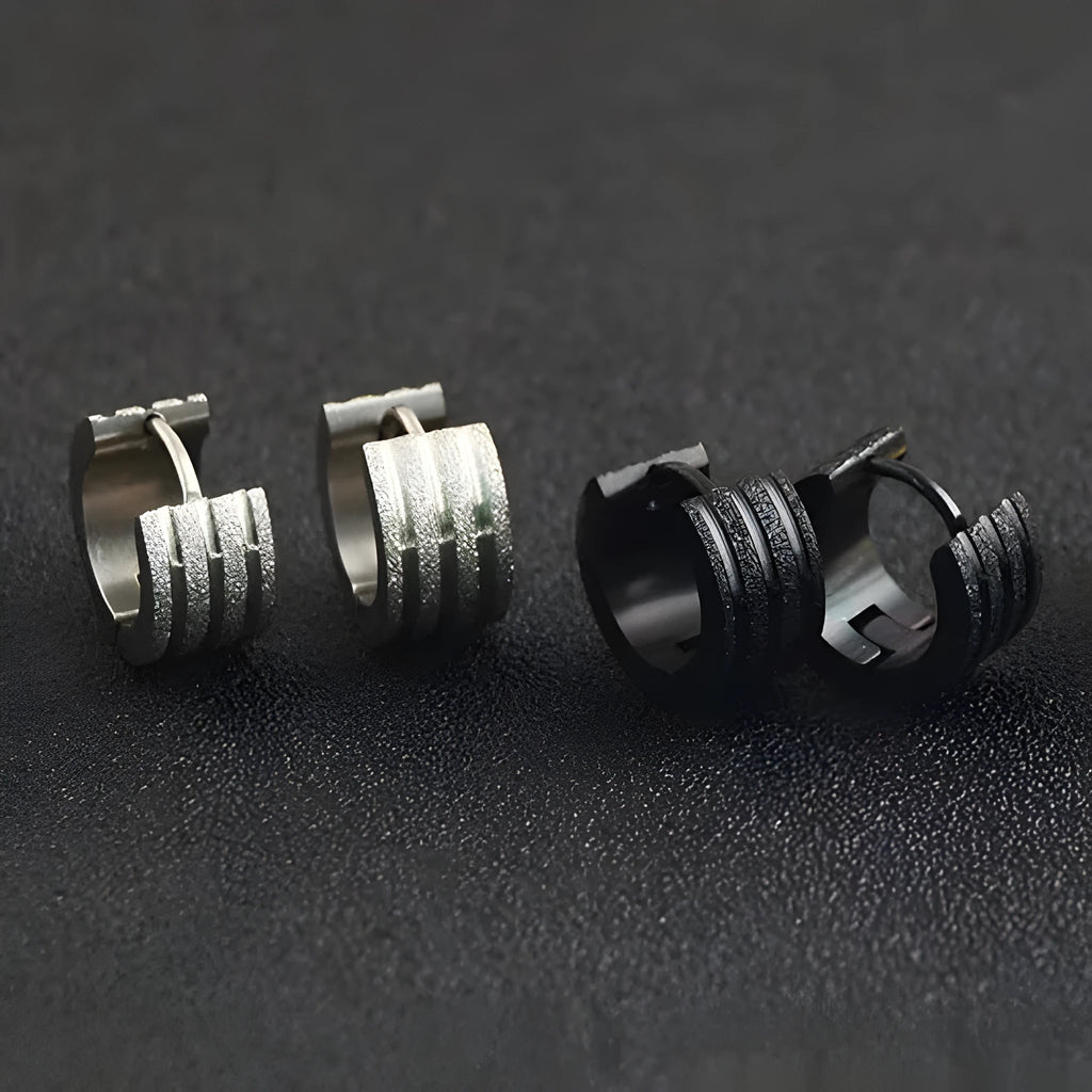 Geometric three-line frosted titanium steel earrings in black, gold, or steel colour on a white background.