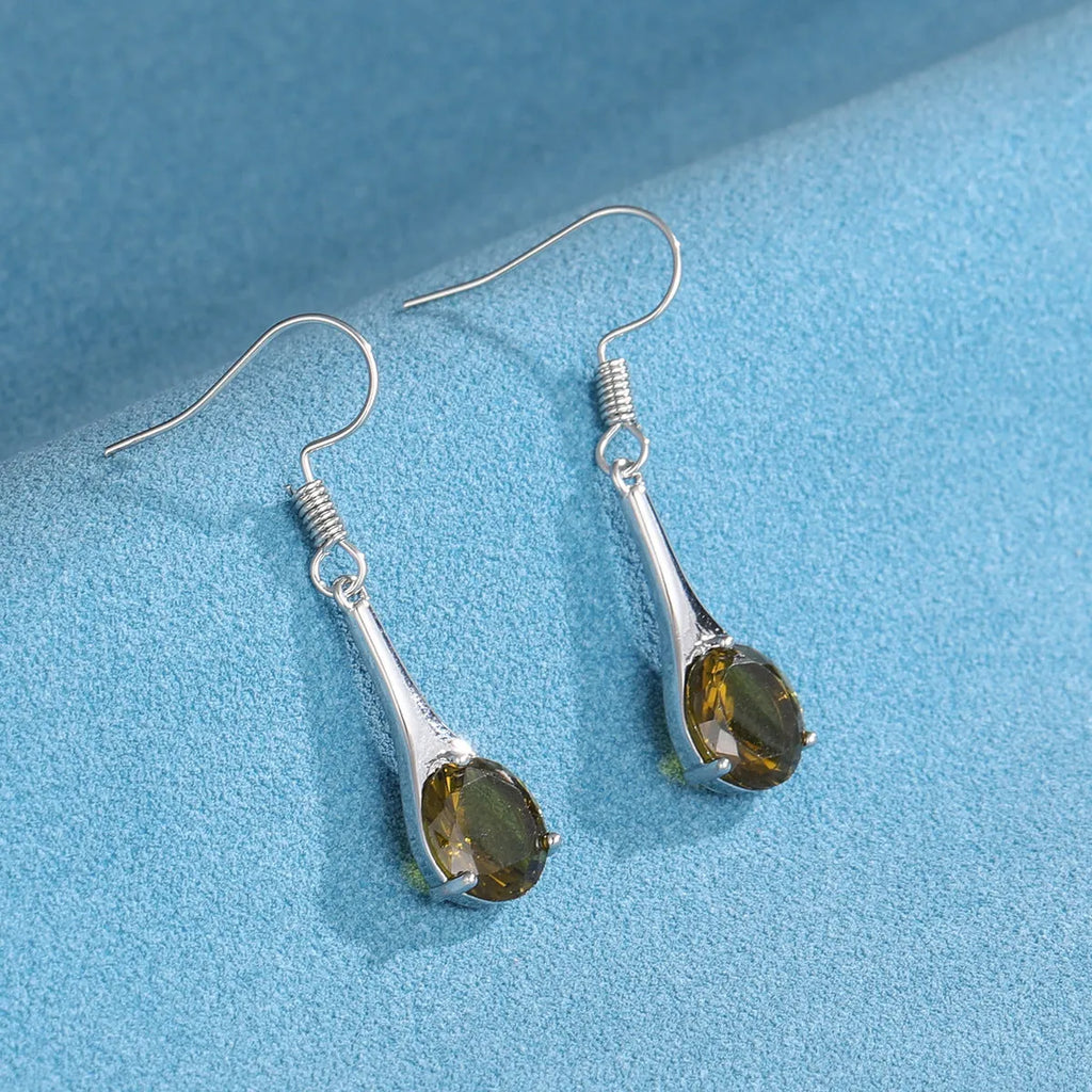 Olive green topaz drop earrings with water drop shape and retro styling