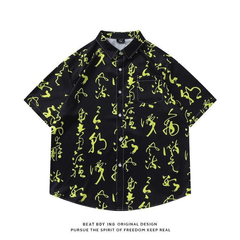 Man's loose-fit short sleeve shirt with a full floral print, styled as an open cardigan.