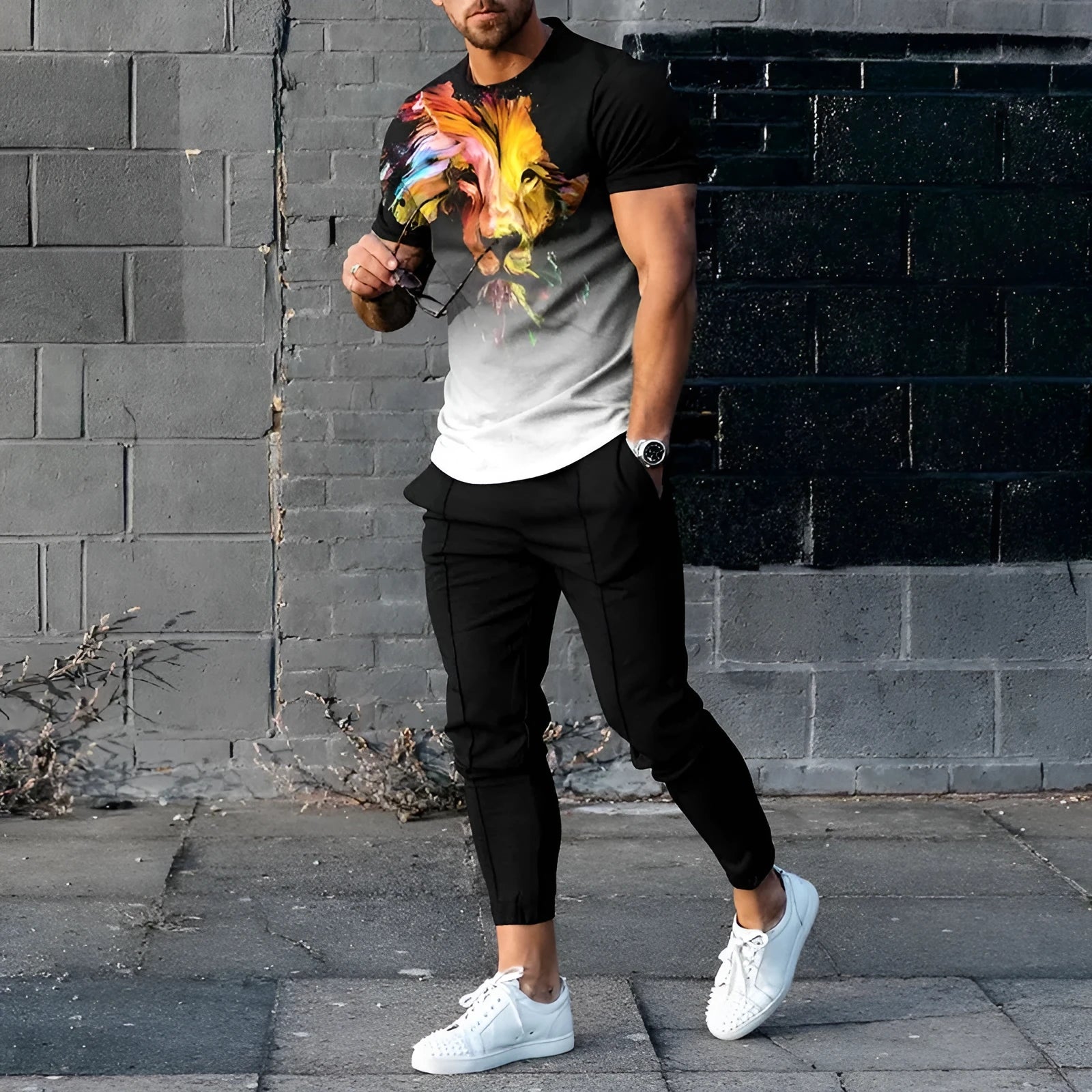 Men's short sleeve printed top and trouser sport suit set in polyester blend fabric.
