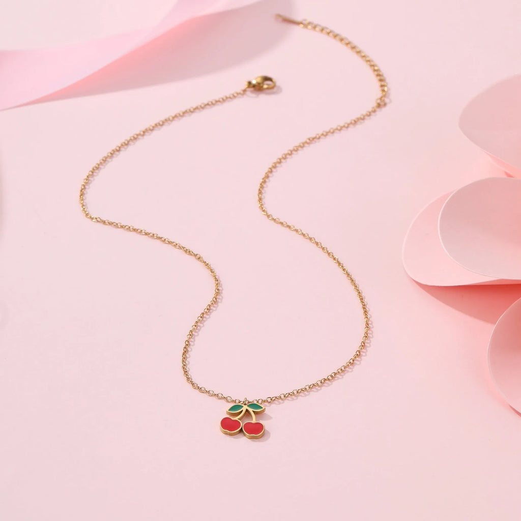 Cherry jewellery set showing necklace, bracelet, earrings, and ring with 18K gold electroplating on stainless steel
