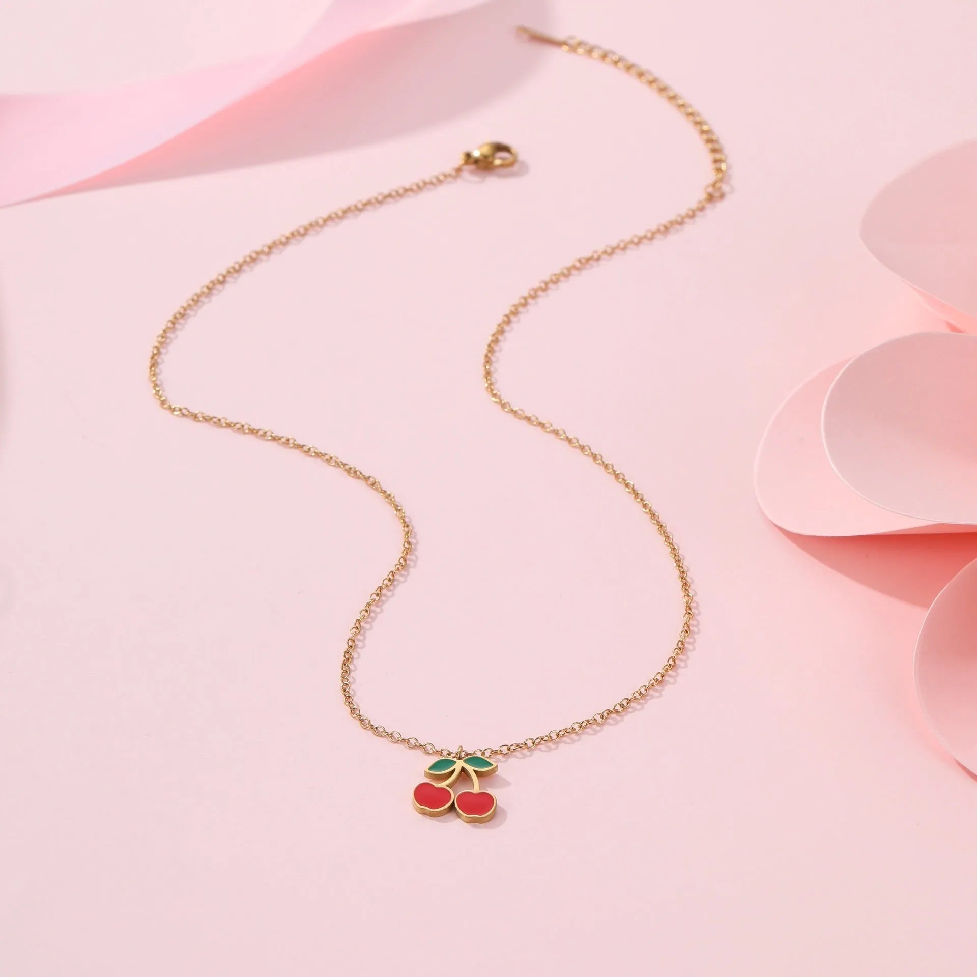 Cherry jewellery set showing necklace, bracelet, earrings, and ring with 18K gold electroplating on stainless steel