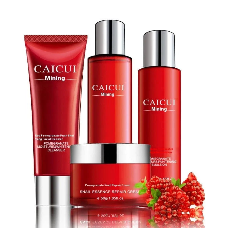 Red packaged pomegranate skincare set containing face wash, toner, lotion and facial cream bottles.