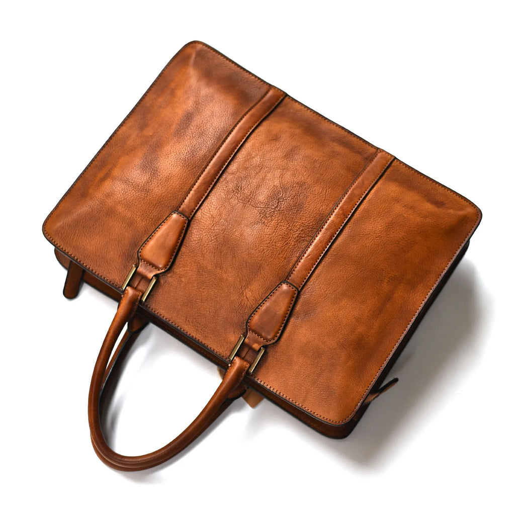 Men's brown leather horizontal business handbag with zip opening showing 14-inch size