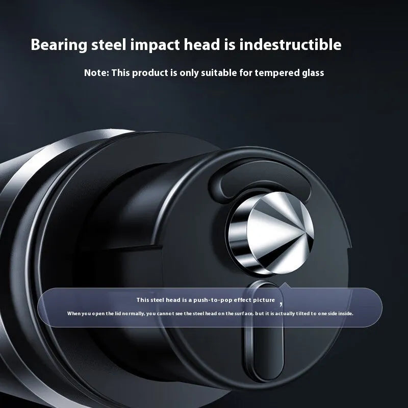 Gun grey aluminium automobile safety hammer with bearing steel impact head on a 3M rubber base next to a test glass piece.