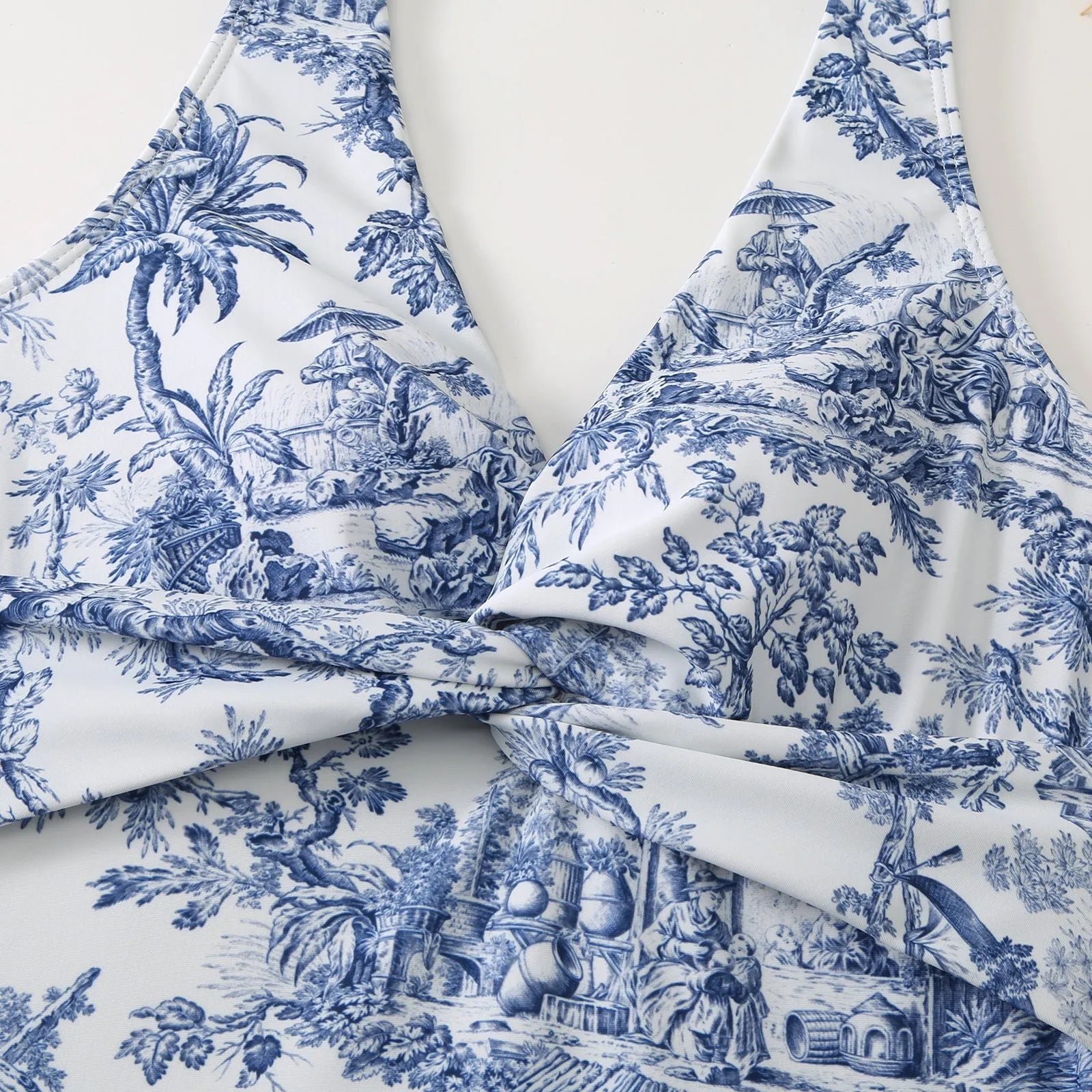 Women's vintage print one-piece swimsuit with short sleeves in a yellow floral pattern.