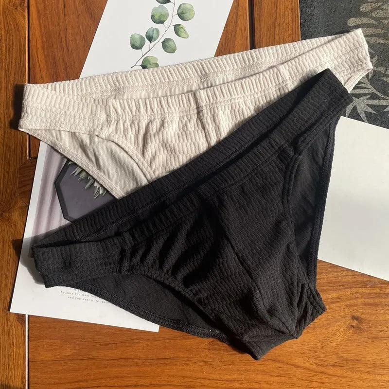 Men's solid colour pure cotton triangle briefs with a mid-waist body-shaping design.