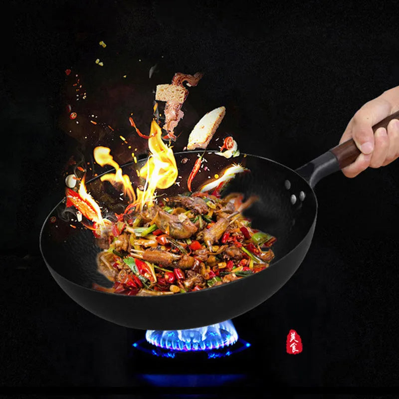 Traditional handmade iron wok pan with wooden handle and induction-compatible base