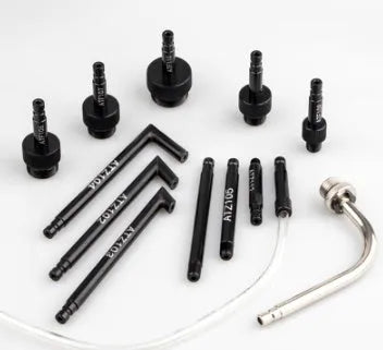 Automatic transmission oil refuelling tool kit with injector and connectors on a workshop bench
