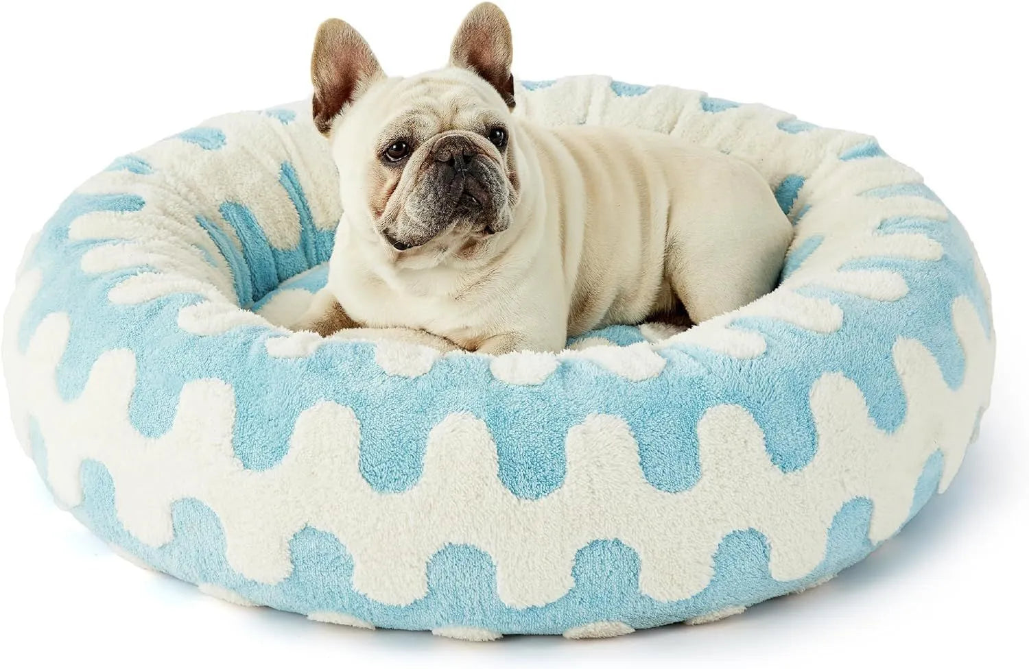 Round plaid-patterned dog bed on a floor, shown in a blue and white colour variant.